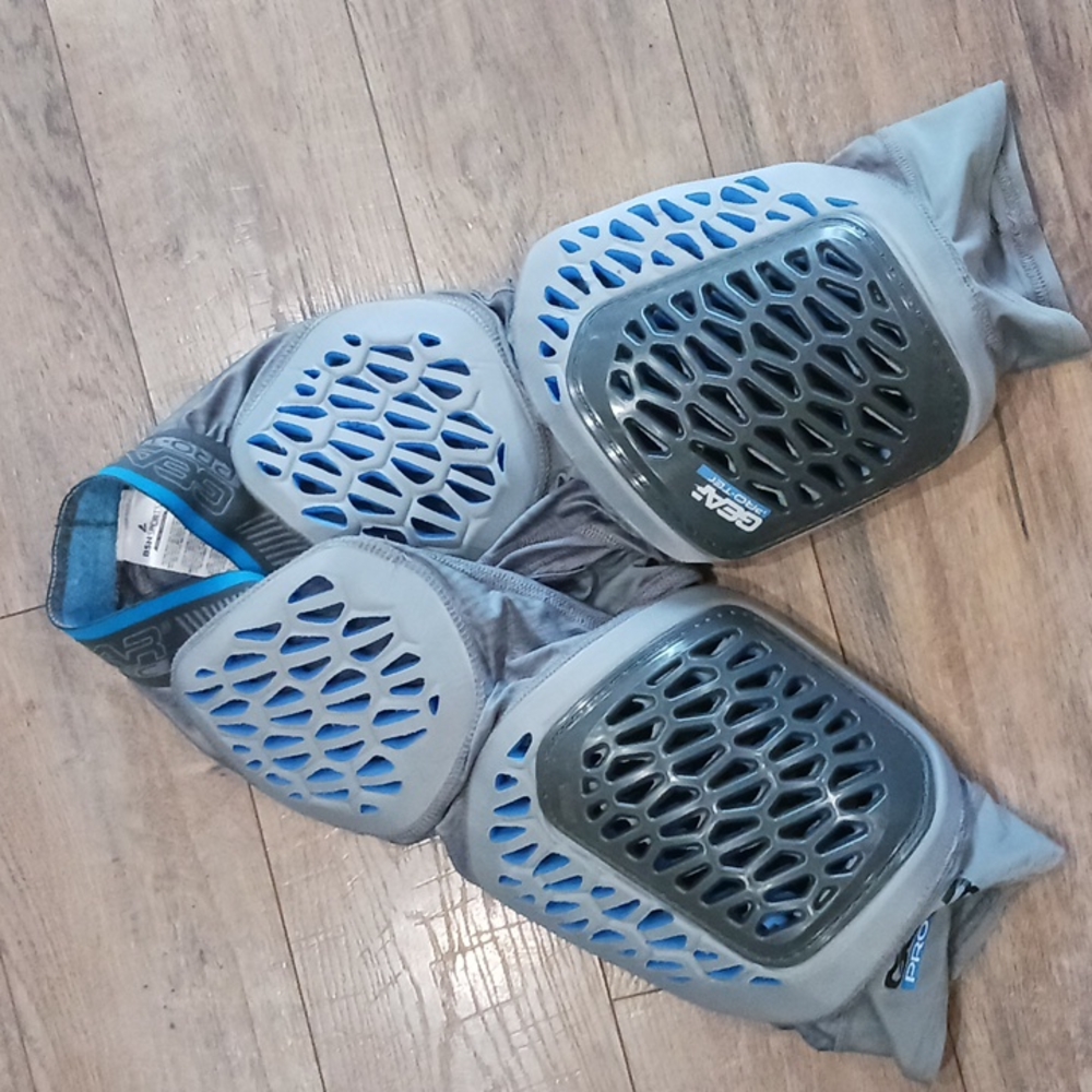 Mens small football pants pads.